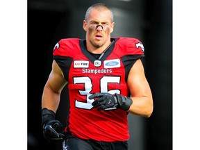 Cory Greenwood of the Calgary Stampeders runs onto the field during player introductions before facing the Toronto Argonauts in CFL football on Thursday, July 18, 2019. Al Charest/Postmedia