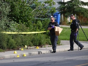 Calgary Police Crime Scene Unit investigators gather evidence in 500 blk of 44 St SE at the scene of a serious assault Sunday, July 14, 2019. Jim Wells/Postmedia