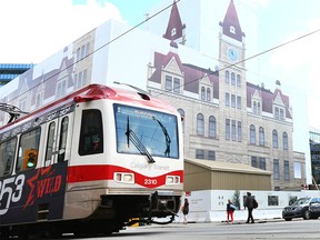 A Calgary Transit train passes by City Hall on 7 Ave in downtown Calgary on Tuesday, July 16, 2019.