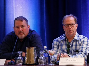 Alex Pourbaix, left, president and CEO of Cenovus Energy and Steve Laut, executive vice chairman of Canadian Natural Resources, speak at the TD Securities Calgary Energy Conference on Tuesday, July 9, 2019.