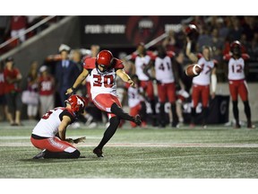 Calgary Stampeders kicker Rene Paredes, makes the winning kick as teammate Rob Maver holds the ball during second half CFL action against the Ottawa Redblacks in Ottawa on Thursday, July 25, 2019. The Stamps took the Redblacks 17-16.