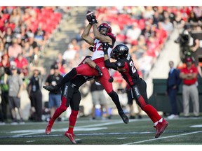 Calgary Stampeders wide receiver Juwan Brescacin makes a catch while taking on the Ottawa Redblacks during first half CFL action in Ottawa on Thursday.