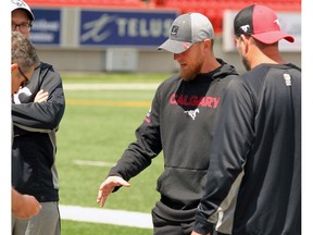 Calgary Stampeders Quarterback Bo Levi Mitchell speaks with Stamps staff following an injury to his pectoral area that occurred during last night's 36-32 victory over the BC Lions. Mitchell is set to receive an MRI on Tuesday.  Sunday, June 30, 2019. Brendan Miller/Postmedia