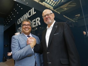 Calgary Mayor Naheed Nenshi and Ken King shake hands as council voted for a new arena in Calgary on Tuesday, July 30, 2019. Darren Makowichuk/Postmedia