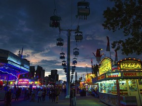 The sun sets behind the iconic chairlift at the Calgary Stampede on Sunday, July 7, 2019.