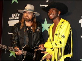 Billy Ray Cyrus and Lil Nas X pose backstage at the BET awards.