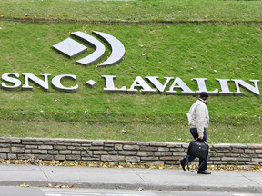 SNC-Lavalin Inc told shareholders Monday it will lose money for a third consecutive quarter, announced a $1.9 billion write-down and proposed its second restructuring initiative this year.