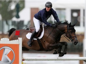 Canada's Tim Wilks rides Loeki Van Het Lindehof during the Kubota Cup at the North American show jumping competition in Calgary on Thursday July 4, 2019. Gavin Young/Postmedia