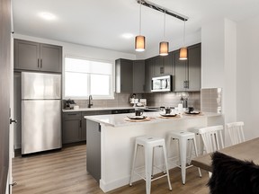 The kitchen in the Bruno Street Town show home by Homes by Avi in Belmont features ample counter space and a window above the kitchen sink.