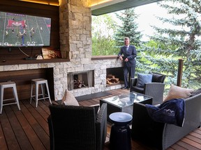 Danny Ritchie, co-owner and president of Ultimate Homes & Renovations, shows off an exterior renovation of a home in Douglasdale, which is open to the public to view. The company is celebrating its 40th anniversary this year.