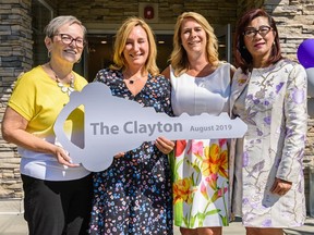 Diane Krecsy, Calgary Homeless Foundation president and CEO, left, Kathy Christiansen, Alpha House executive director, Bernadette Majdell, HomeSpace Society CEO, and Seniors and Housing Minister Josephine Pon pose for a photo in the grand opening of the Clayton, a safe place for Calgary homeless, on Thursday, August 8, 2019.