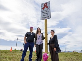 Adele Dirks, Alfred Benary's wife, right, and her daughters D. Dirks and Ashleigh Dirks pose for a photo after they unveil Albertas first roadside memorial sign for Benary who was a victim of impaired driving on Friday, August 23, 2019. Benary died in October 2015 from injuries sustained weeks earlier at a crash caused by an impaired driver.