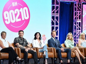 BEVERLY HILLS, CA - AUGUST 07: Gabrielle Carteris, Brian Austin Green, Shannen Doherty, Ian Ziering, Jennie Garth andTori Spelling of BH 90210 speak during the Fox segment of the 2019 Summer TCA Press Tour at The Beverly Hilton Hotel on August 7, 2019 in Beverly Hills, California.