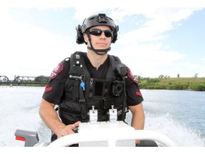 Cst. Ryan Schroeder operates the Calgary Police Marine Unit's boat. The Calgary Police and Fire services are reminding residents to follow the rules while on the water during the long weekend as they ramp up their patrols.