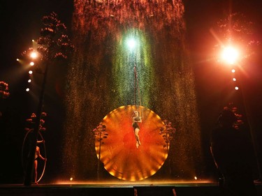 Performers rehearse a scene using a waterfall in Cirque Du Soleil's Luzia.