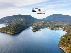 A Harbour Air Seaplanes float plane flying over Bowen Island.