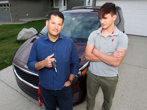 Renato Barros and his 16-year-old son Lucas pose for a photo in their driveway. Although Lucas is ready to take his driver's licence examination, there are no available times in Calgary until November.