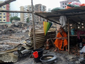 TOPSHOT - A resident rests in a temporary shelter in a slum in Dhaka on August 18, 2019, after a fire broke out late on August 17 at Mirpur neighbourhood. - At least 10,000 people are homeless after a massive fire swept through a crowded slum in the Bangladesh capital and destroyed thousands of shanties, officials said on August 18. (Photo by MUNIR UZ ZAMAN / AFP)MUNIR UZ ZAMAN/AFP/Getty Images