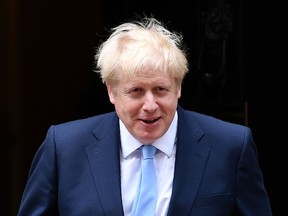 (FILES) In this file photo taken on August 07, 2019 Britain's Prime Minister Boris Johnson prepares to greet King Abdullah II of Jordan outside 10 Downing Street in London on August 7, 2019, ahead of bilateral talks and a working lunch. - Prime Minister Boris Johnson makes his debut on the global stage at the G7 summit this weekend, August 24, 2019, where all eyes will be on his chumminess with US President Donald Trump.