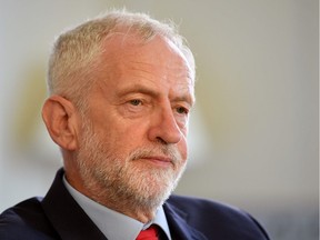 Britain's opposition Labour Party leader, Jeremy Corbyn, poses for a photograph as he prepares to meet with leaders of Britain's other political parties to discuss options for Brexit, in Portcullis House, central London on August 27, 2019. - Labour leader Jeremy Corbyn will on Tuesday attempt to bridge deep divisions with other opposition parties on how to avoid Britain crashing out of the EU on October 31. Corbyn said he would "do everything necessary" to stop a no-deal Brexit, following leaked official warnings that this could lead to food, fuel and medicine shortages.