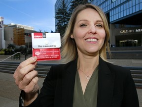 Barb Doyscher, business strategist with the City of Calgary, displays one of 6,000 reusable pocket ashtrays which will be distributed to smokers during the anti-litter campaign.