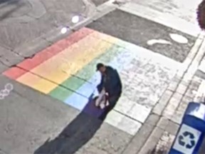 Police have released images of a possible suspect wanted in connection for vandalizing the rainbow crosswalk in downtown Calgary on August 18
