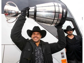 Calgary Stampeders Jon Cornish and teammates were back at McMahon Stadium with the Grey Cup after winning the 102nd Grey Cup in Vancouver in Calgary, Alta. on Monday December 1 2014. Darren Makowichuk/Calgary Sun/QMI Agency
