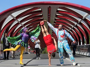 Performers with Cirque du Soleil's Luzia pose at the Peace Bridge on Tuesday, April 27, 2019. From left are: dancer Tatsiana Yurkavets, acrobat Sascha Bachmann and swing-to-swing artist Yuri Tsvirko.