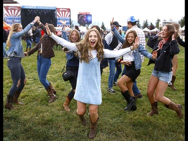 Music fans dance on the first day of the Country Thunder music festival, held at Prairie Winds Park in Calgary Friday, August 16, 2019. Dean Pilling/Postmedia