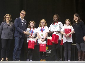 Left to right: Dr. Lesley Rigg (dean, Faculty of Science), Dr. Steven Vamosi (associate dean, Diversity, Equity & Inclusion, Faculty of Science), Emma Cutler, Claire Palmer, Tito Akinlosotu, Sarah Jacobson, Dr. Mea Wang (associate professor, Faculty of Science and Technovation Regional Ambassador, Calgary). The four girls will be traveling to Silicon Valley next week to highlight the app they developed, Cloud9, at the Technovation World Pitch finals August 12-16. Adrian Shellard/University of Calgary.