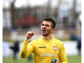 Cavalry FC keeper Marco Carducci gestures to Calgary fans as he celebrates a win following CPL soccer action between FC Edmonton and Cavalry FC in Calgary at Atco Field at Spruce Meadows on Saturday, May 18, 2019. Jim Wells/Postmedia