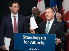 Alberta Justice Minister Doug Schweitzer, left, and Premier Jason Kenney.
