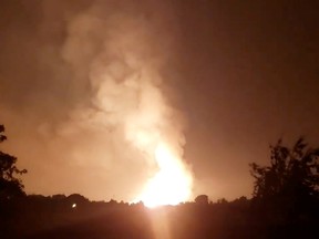 Flames light up the sky after an Enbridge gas pipeline explosion in rural Moreland, Kentucky on Aug. 1, 2019. Still image taken from social media video.