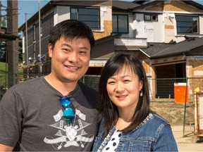 Antonio Ge and Kathy Zheng in front of their new home in the Hamptons.