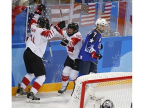 Canada forward Haley Irwin, left, celebrates her goal on United States with teammate Blayre Turnbull during their game at the 2018 Olympic Winter Games in Pyeongchang, South Korea, on Wednesday, February 21, 2018. Leah Hennel/Postmedia