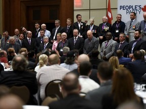 People's Party of Canada candidates for the 2019 election who are veterans stand on stage during an announcement on veterans policy at the PPC National Conference in Gatineau, Que. on Sunday, Aug. 18, 2019.