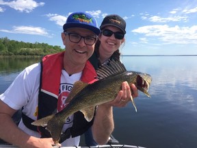 Jim Hoey with his daughter on location.