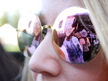 The stage is reflected in sunglasses during  the third day of the Country Thunder music festival, held at Prairie Winds Park in Calgary Saturday, August 17, 2019. Dean Pilling/Postmedia