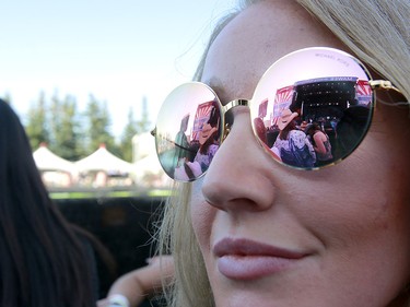 The stage is reflected in sunglasses during  the third day of the Country Thunder music festival, held at Prairie Winds Park in Calgary Saturday, August 17, 2019. Dean Pilling/Postmedia
