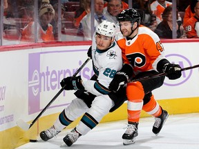 Andrew MacDonald, right, plays for the Philadelphia Flyers in a game on Nov. 28, 2017.