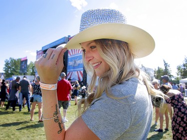 Chelsea Lylick enjoys the sunshine as Roots and Boots perform on the third day of the Country Thunder music festival, held at Prairie Winds Park in Calgary Saturday, August 17, 2019. Dean Pilling/Postmedia