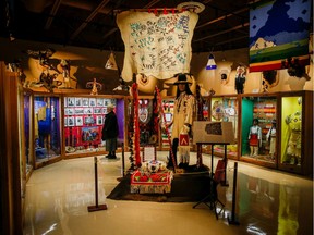 Donna Livingstone, president and CEO of the Glenbow Museum, looks over the new displays before the official opening of the new Tsuut'ina Cultural Museum on ?Friday, June 1, 2018, west of Calgary, on the Tsuut'ina Nation. The indigenous museum will be a centre for preserving the culture and history of the Tsuut'ina way of life.  Al Charest/Postmedia