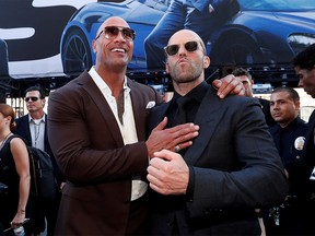 FILE PHOTO: Cast members Dwayne Johnson and Jason Statham arrive at the premiere for "Fast & Furious Presents: Hobbs & Shaw" in Los Angeles, California, U.S., July 13, 2019. REUTERS/Mario Anzuoni/File Photo ORG XMIT: FW1