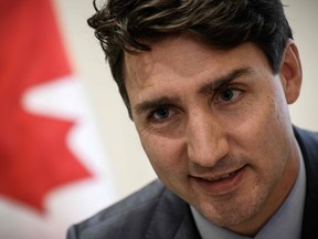 Canadian Prime Minister Justin Trudeau looks on during an interview at the Canadian Embassy in Paris on November 12, 2018.