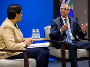 Finance Minister Travis Toews speaks with Calgary Chamber  of Commerce president Sandip Lalli.