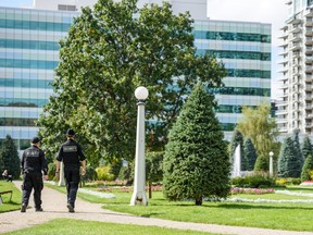 Two security guards patrol Central Memorial Park in Calgary on Wednesday, September 11, 2019.  Azin Ghaffari/Postmedia Calgary