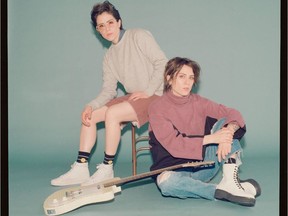 Sara Quin (on chair) and Tegan Quin of Tegan and Sara. Courtesy, Warner Records.