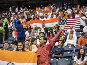HOUSTON, TX - SEPTEMBER 22: Attendees chant and cheer inside NRG Stadium ahead of a visit by Indian Prime Minister Nerenda Modi on September 22, 2019 in Houston, Texas. The rally, which U.S. President Donald Trump was expected to attend and draw tens of thousands of Indian-Americans, comes ahead of Modi's trip to New York for the United Nations General Assembly.  (Photo by Sergio Flores/Getty Images)