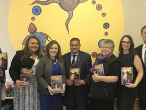 Suicide-prevention resources for Indigenous youth  (L to R) Elder Travis Plaited Hair, Jennifer Houle-Famakine, Minister Rebecca Schulz, MLA Peter Singh, Elder Gloria Laird, Mara Grunau and MLA Jeremy Nixon support the launch of new suicide prevention graphic novels for First Nations and Metis youth. Supplied photo