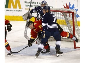 Men's UCalgary Dinos, Tim Vanstone battles MRU Cougars', Jesse Lees in second period action as the Calgary Flames hosted the Crowchild Classic at the Scotiabank Saddledome on. The on-ice contests will feature the women's and men's hockey teams from the University of Calgary and Mount Royal University in back-to-back action. This double header is a part of the Crowchild Classic series, an ongoing contest between the two universities on Tuesday January 29, 2019. Darren Makowichuk/Postmedia